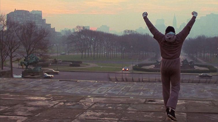 a still from the motion picture Rocky, showing Rocky on the steps